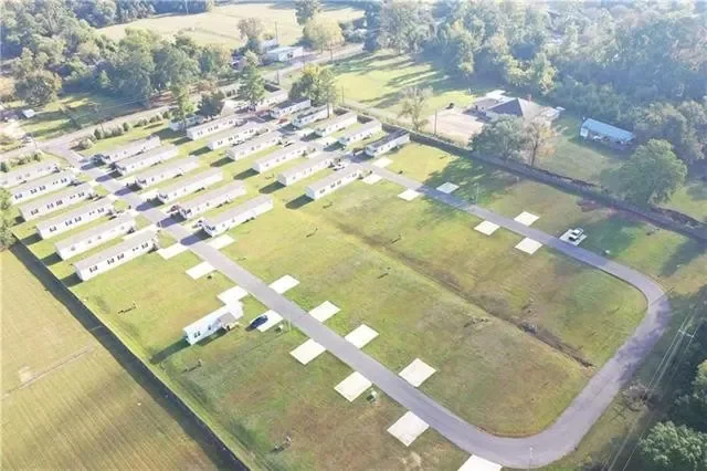 Earlier aerial photograph showing the property road and existing pads